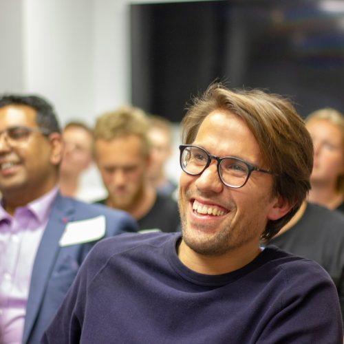 man in black crew neck shirt wearing black framed eyeglasses